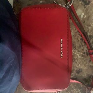 A red Michael Kors wrap around purse!